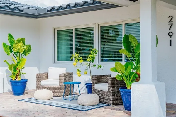 a vase of flowers sitting on a dining table