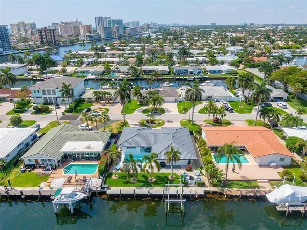 an aerial view of a house with a lake view