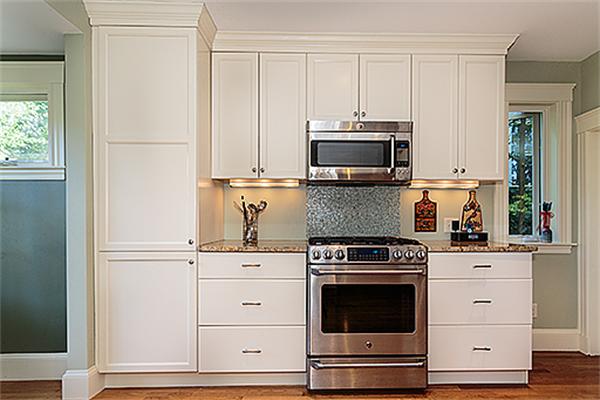36 Argyle Road Arlington, MA 02476 - Photo 14 of 26 a kitchen with white cabinets and appliances