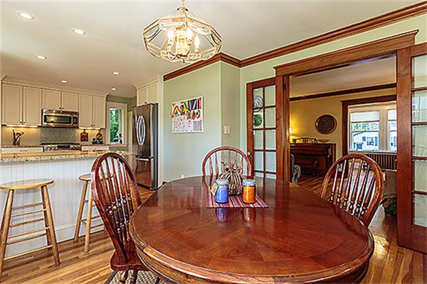 36 Argyle Road Arlington, MA 02476 - Photo 9 of 26 a dining room with furniture a chandelier and wooden floor