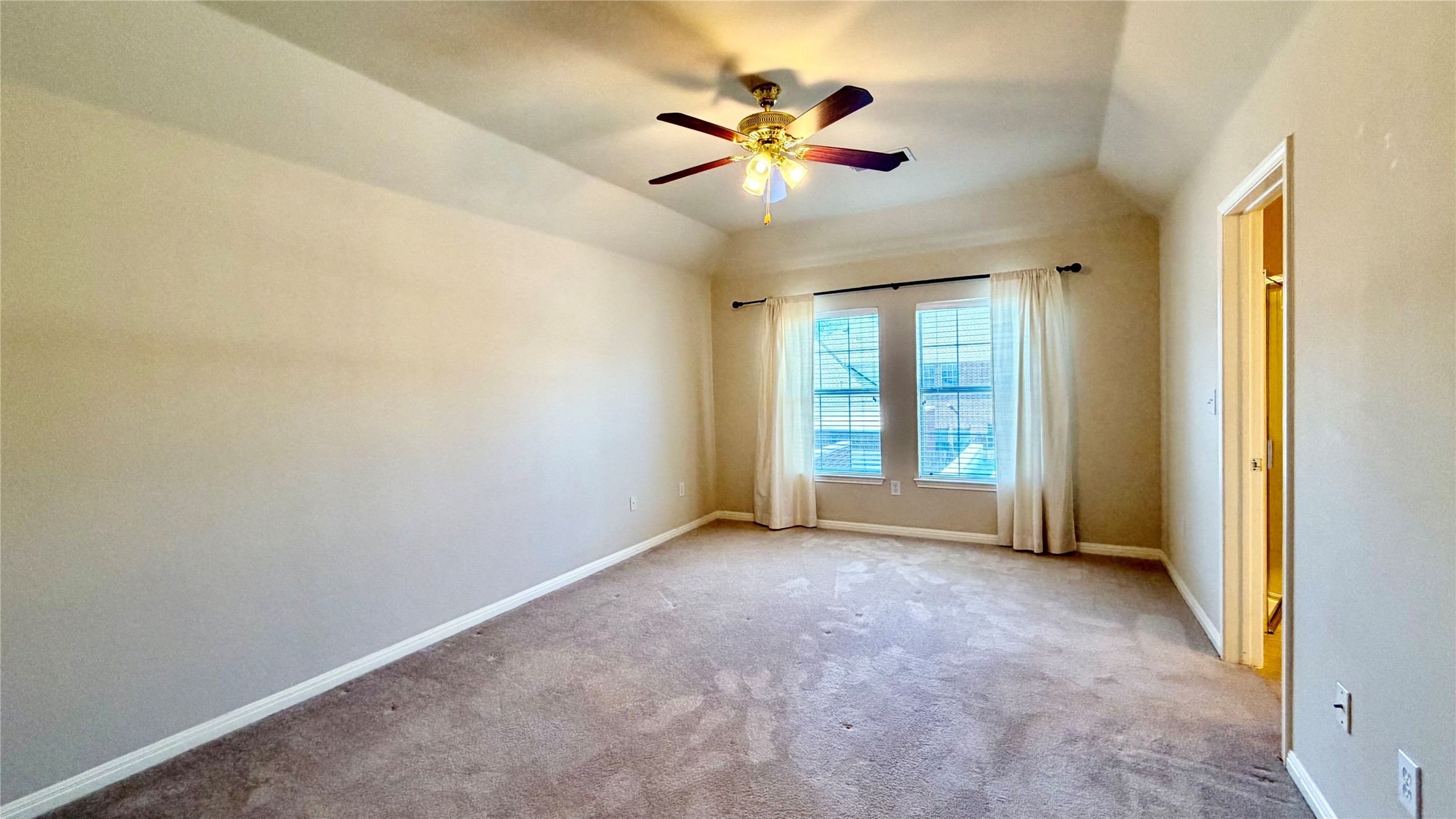 5515 Davis Lane, Unit 82 Austin, TX 78749 - Photo 21 of 28 View of the primary bedroom which is the second of two second floor bedrooms with en suite bath and two walk-in closet.