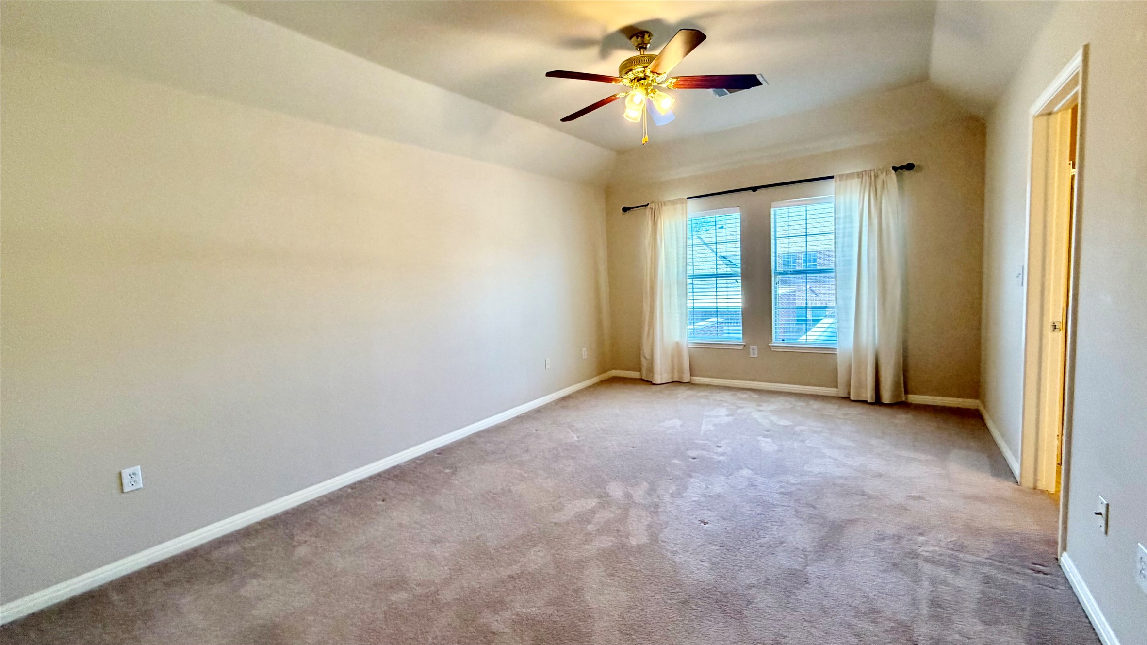 5515 Davis Lane, Unit 82 Austin, TX 78749 - Photo 22 of 28 View of the primary bedroom which is the second of two second floor bedrooms with en suite bath and two walk-in closet.
