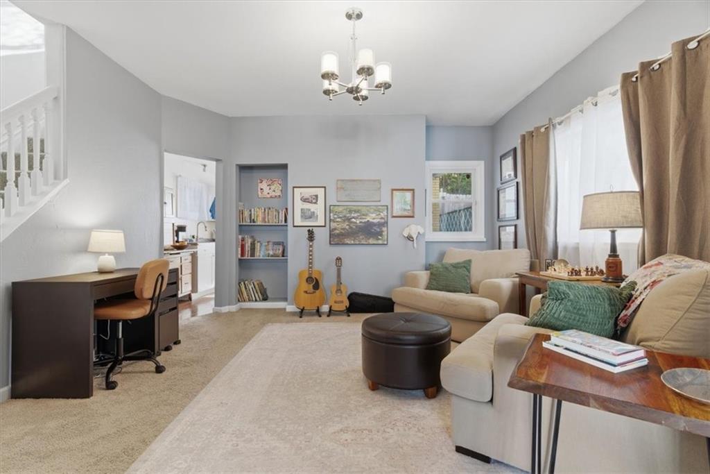 246 Dunseith Street Pittsburgh, PA 15213 - Photo 7 of 36 a living room with furniture a lamp and a chandelier