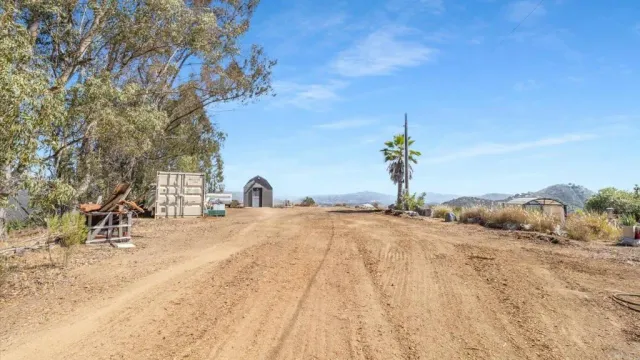 a view of a backyard of a house