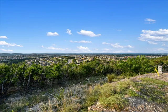 a view of a lake with a yard