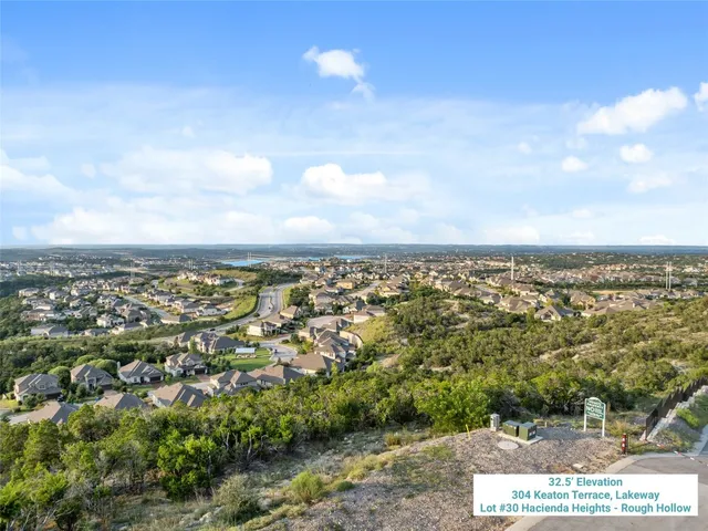 an aerial view of residential building and trees around