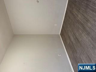 1131 Main Street Paterson, NJ 07503 - Photo 3 of 10 a view of an empty room with wooden floor