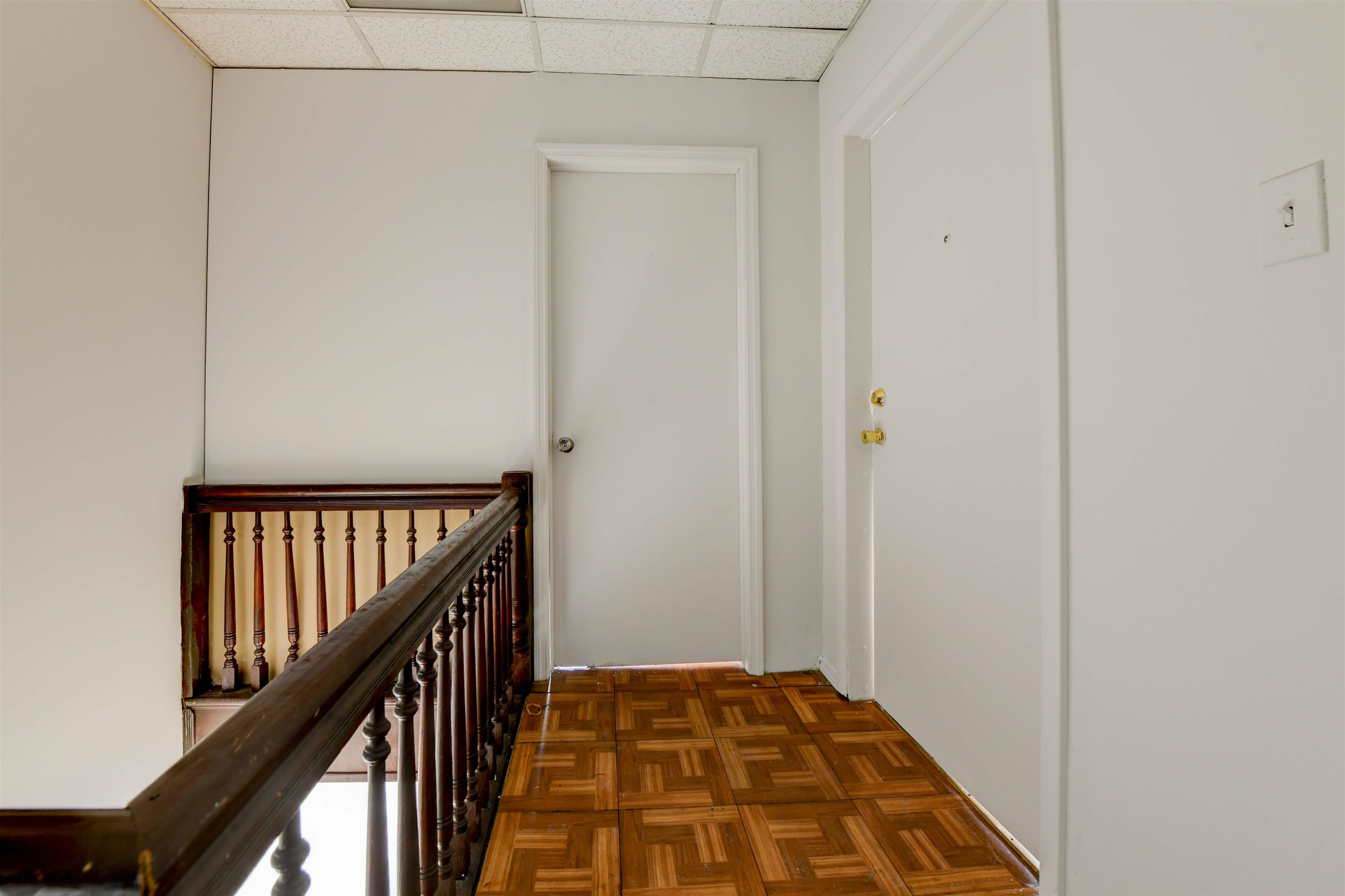 625 Harrison Avenue, Unit 2 Harrison, NJ 07029 - Photo 18 of 25 a view of a hallway with wooden floor and staircase