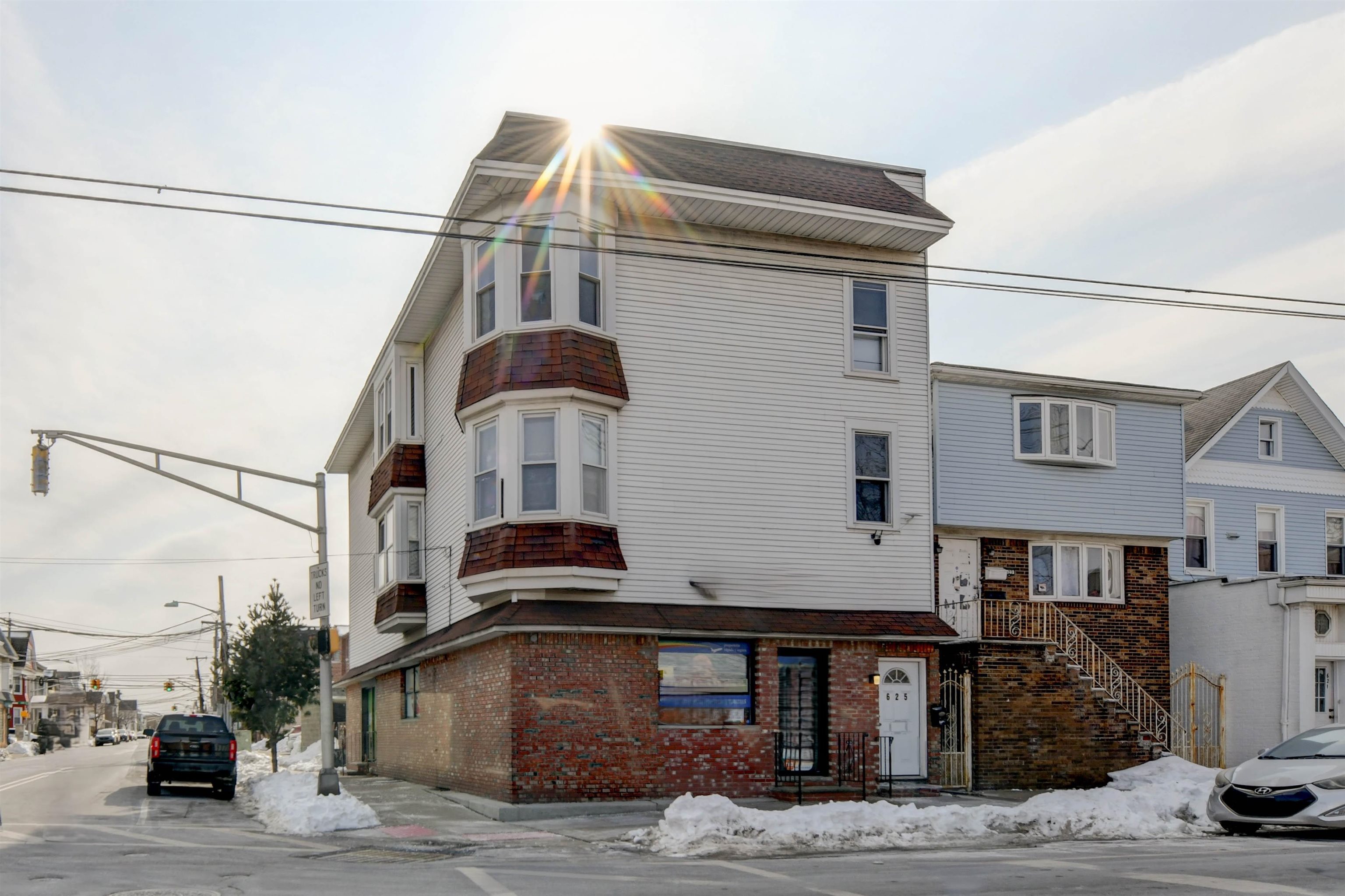 625 Harrison Avenue, Unit 2 Harrison, NJ 07029 - Photo 19 of 25 a front view of a house with a yard