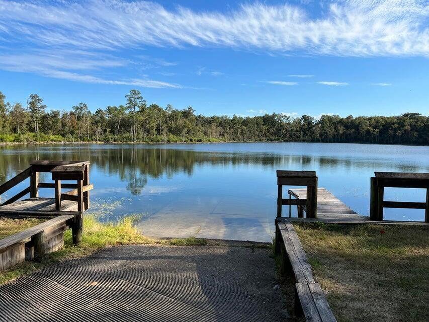Lot 16 Sable Court Chipley, FL 32428 - Photo 3 of 12 a view of a lake with a floor to ceiling window next to a yard