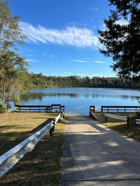 Lot 16 Sable Court Chipley, FL 32428 - Photo 6 of 12 a view of a lake with houses in the back