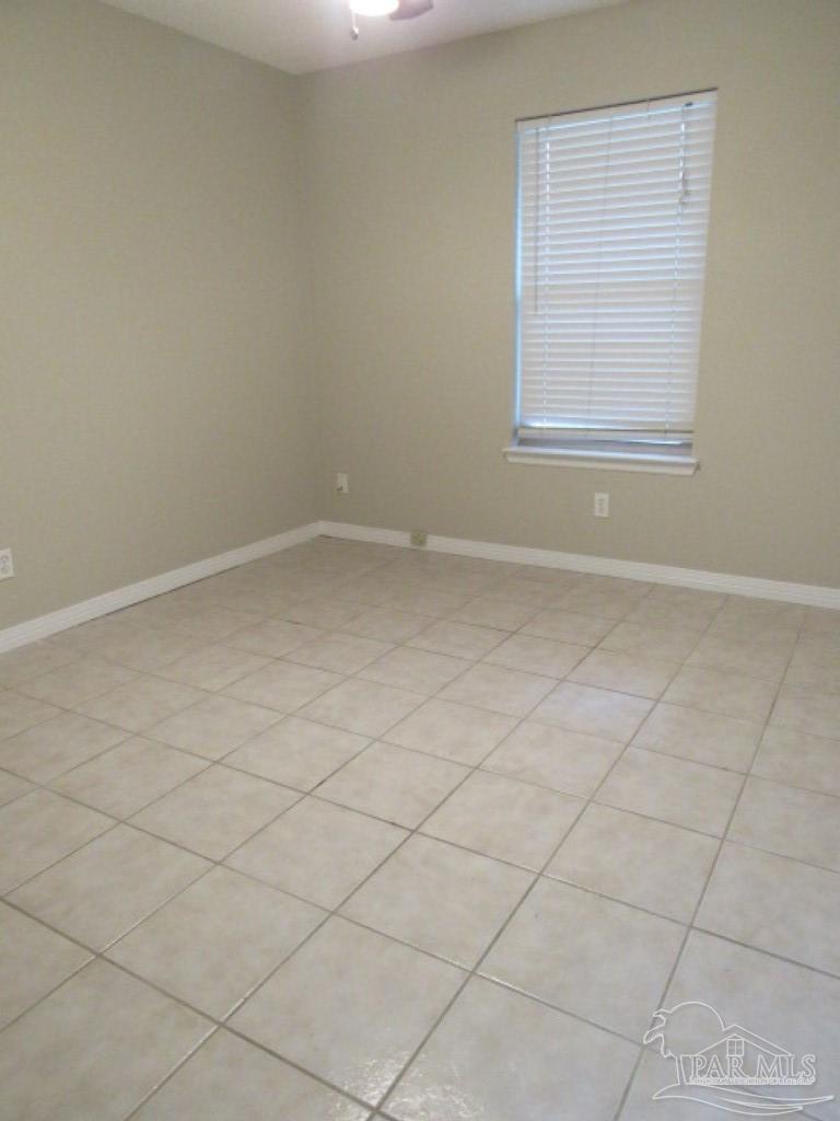 3322 Pine Forest Road Cantonment, FL 32533 - Photo 9 of 9 an empty room with a empty space and a window