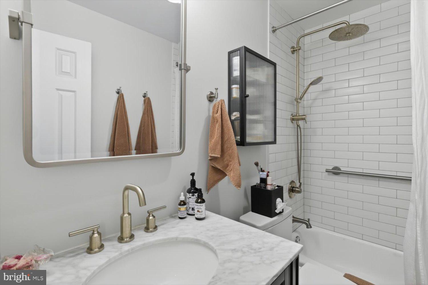 410 5th Street Northeast, Unit 1 Washington, DC 20002 - Photo 16 of 37 Sleek modern bathroom with elegance.