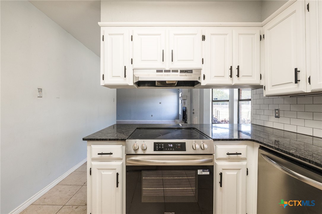 554 County Road 4707 Kempner, TX 76539 - Photo 11 of 33 a stove top oven sitting inside of a kitchen