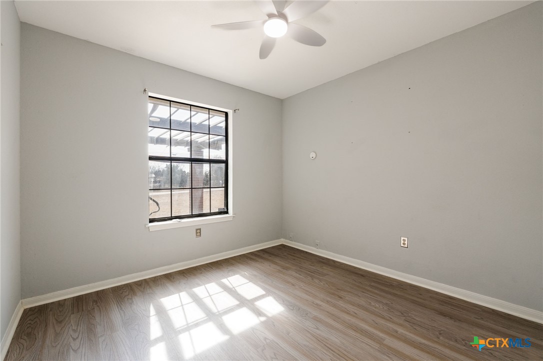 554 County Road 4707 Kempner, TX 76539 - Photo 18 of 33 wooden floor in an empty room with a window