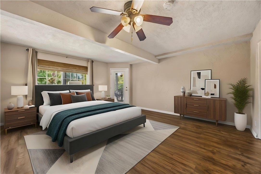 1485 Vía Ladera Fallbrook, CA 92028 - Photo 33 of 43 a bedroom with a bed and a chandelier