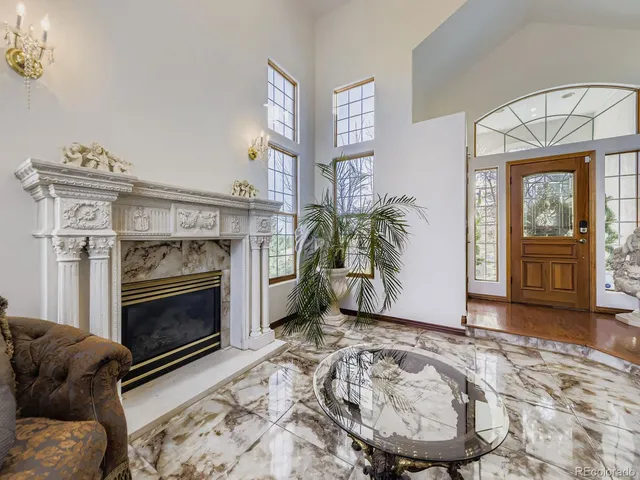 a kitchen with stainless steel appliances granite countertop a refrigerator a stove and a sink