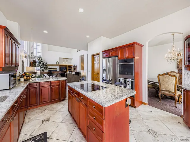 a spacious bedroom with a bed couch and a window
