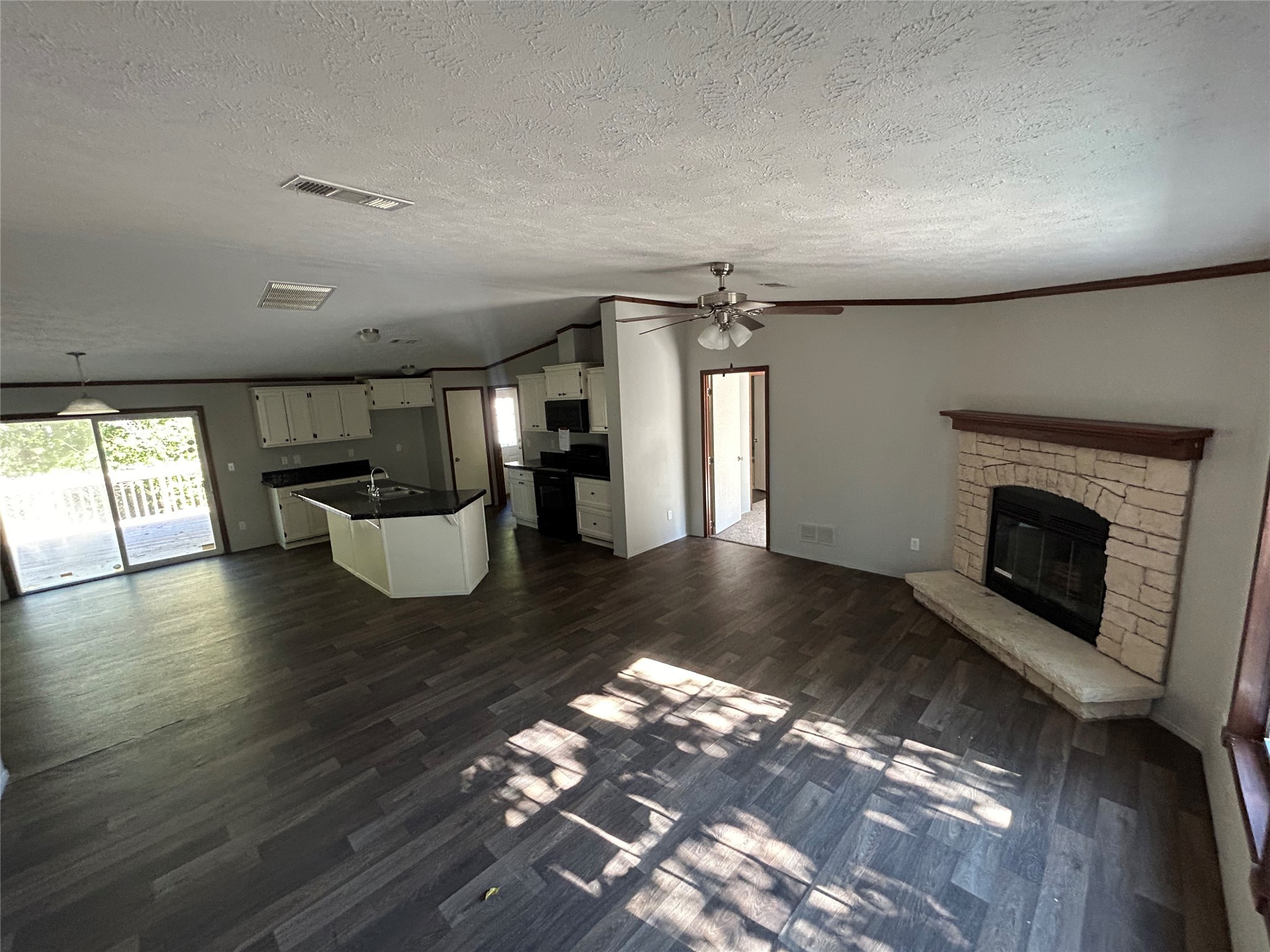 239 St Lucia Lane Point Blank, TX 77364 - Photo 6 of 6 a living room with hard wood floors and a fireplace