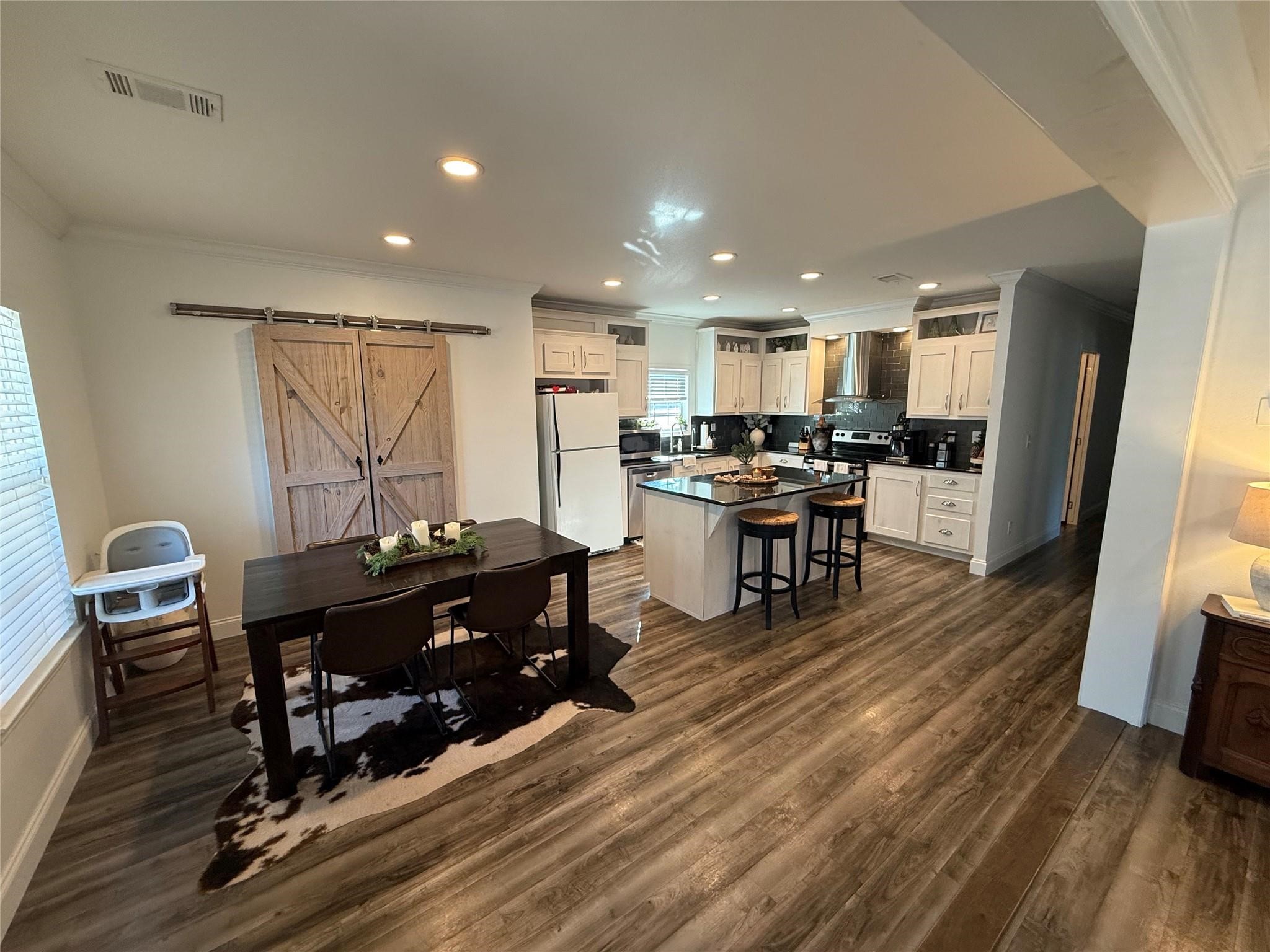 16607 Mueschke Road Cypress, TX 77433 - Photo 15 of 24 a living room with furniture and a wooden floor