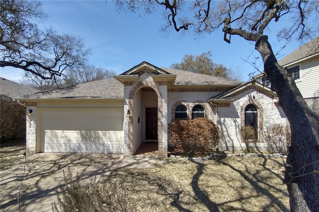 7200 Bending Oak Road Austin, TX 78749 - Photo 1 of 1 a front view of a house with garden