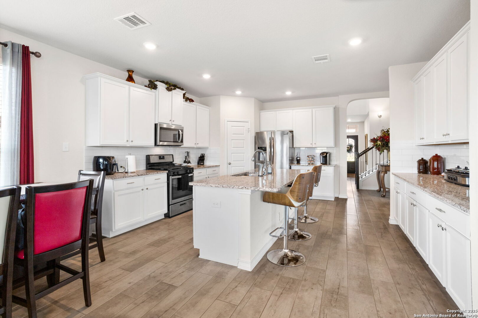 104 Mossy Bank Cibolo, TX 78108 - Photo 11 of 30 a view of kitchen with cabinets and wooden floor