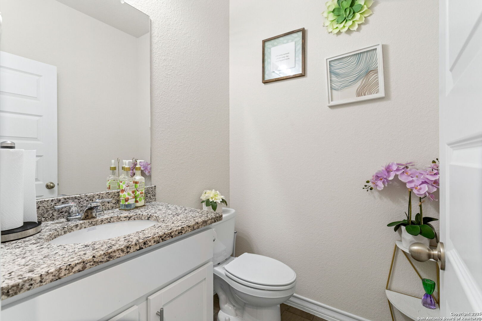 104 Mossy Bank Cibolo, TX 78108 - Photo 13 of 30 a bathroom with a granite countertop sink a toilet and a mirror