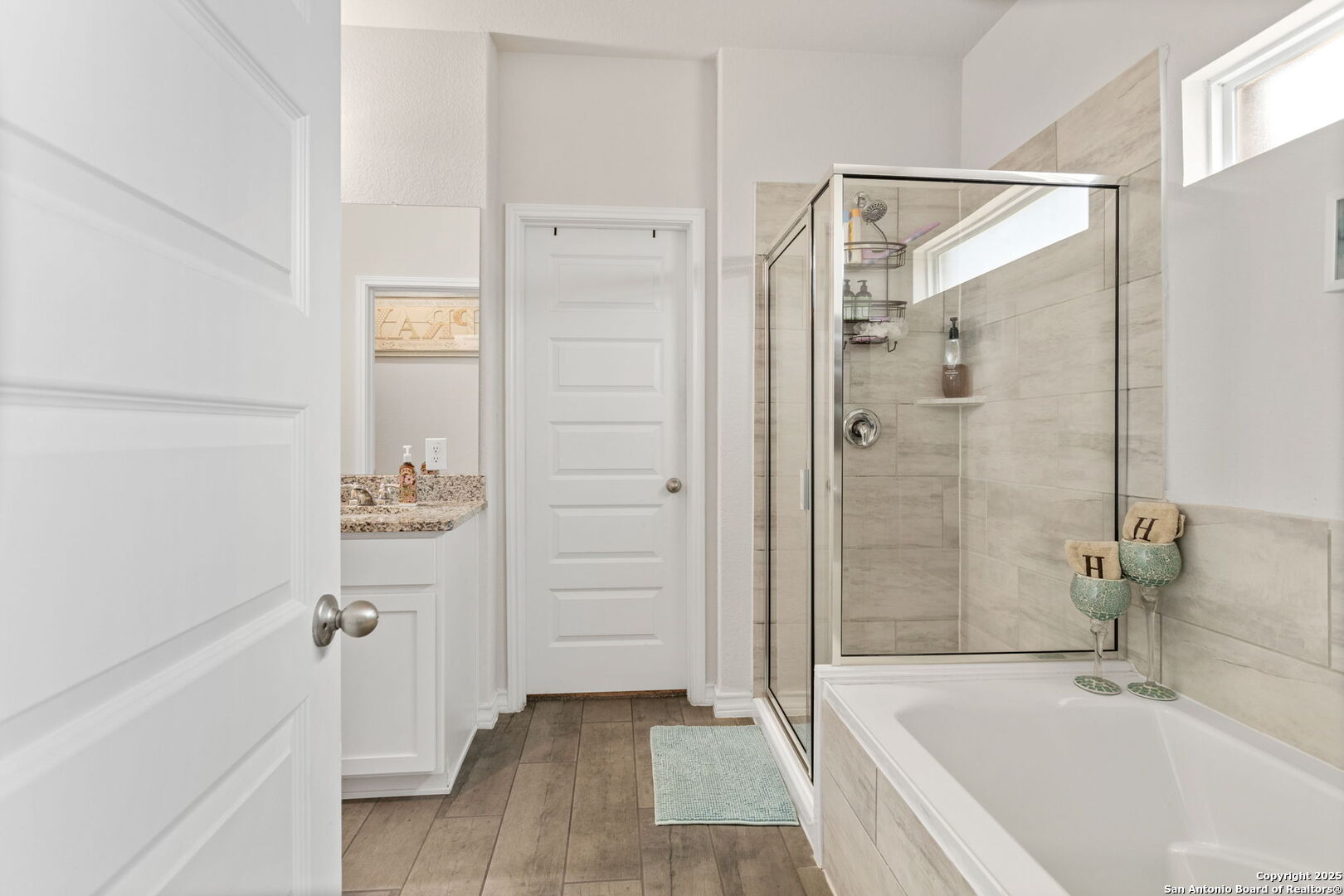 104 Mossy Bank Cibolo, TX 78108 - Photo 15 of 30 a bathroom with a bathtub and a shower