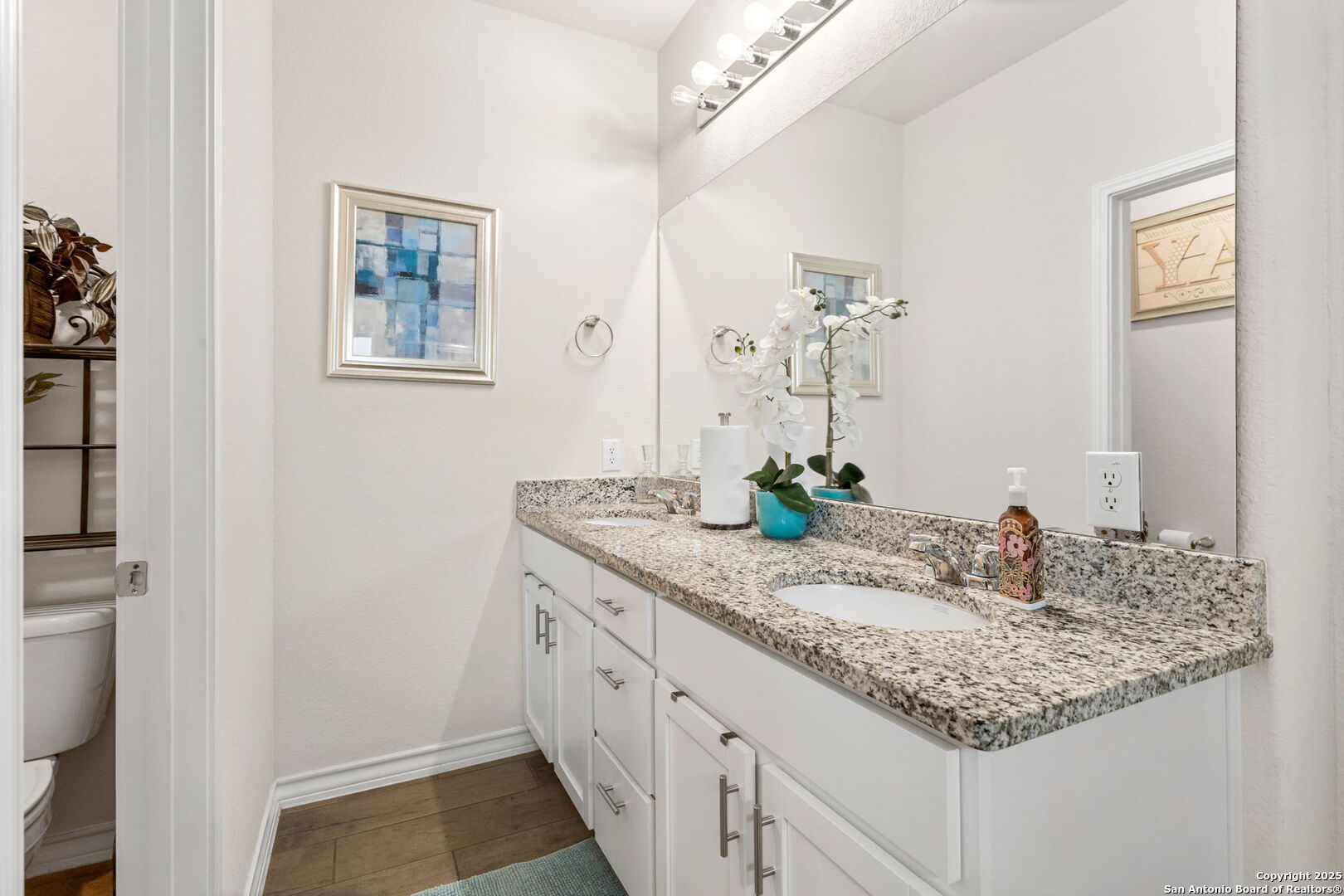 104 Mossy Bank Cibolo, TX 78108 - Photo 16 of 30 a bathroom with a granite countertop sink and a mirror