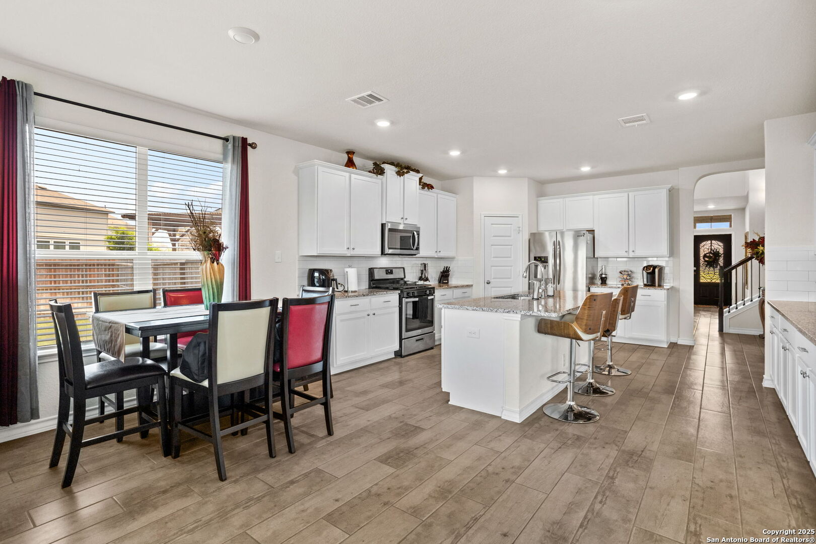 104 Mossy Bank Cibolo, TX 78108 - Photo 2 of 30 a living room with furniture and kitchen view with wooden floor