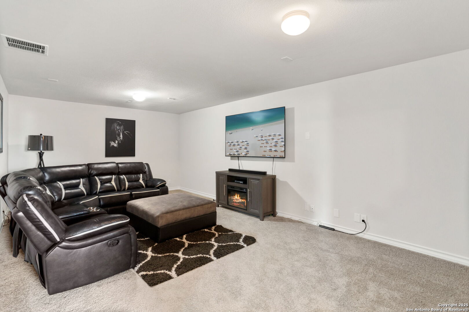 104 Mossy Bank Cibolo, TX 78108 - Photo 21 of 30 a living room with furniture and a fireplace