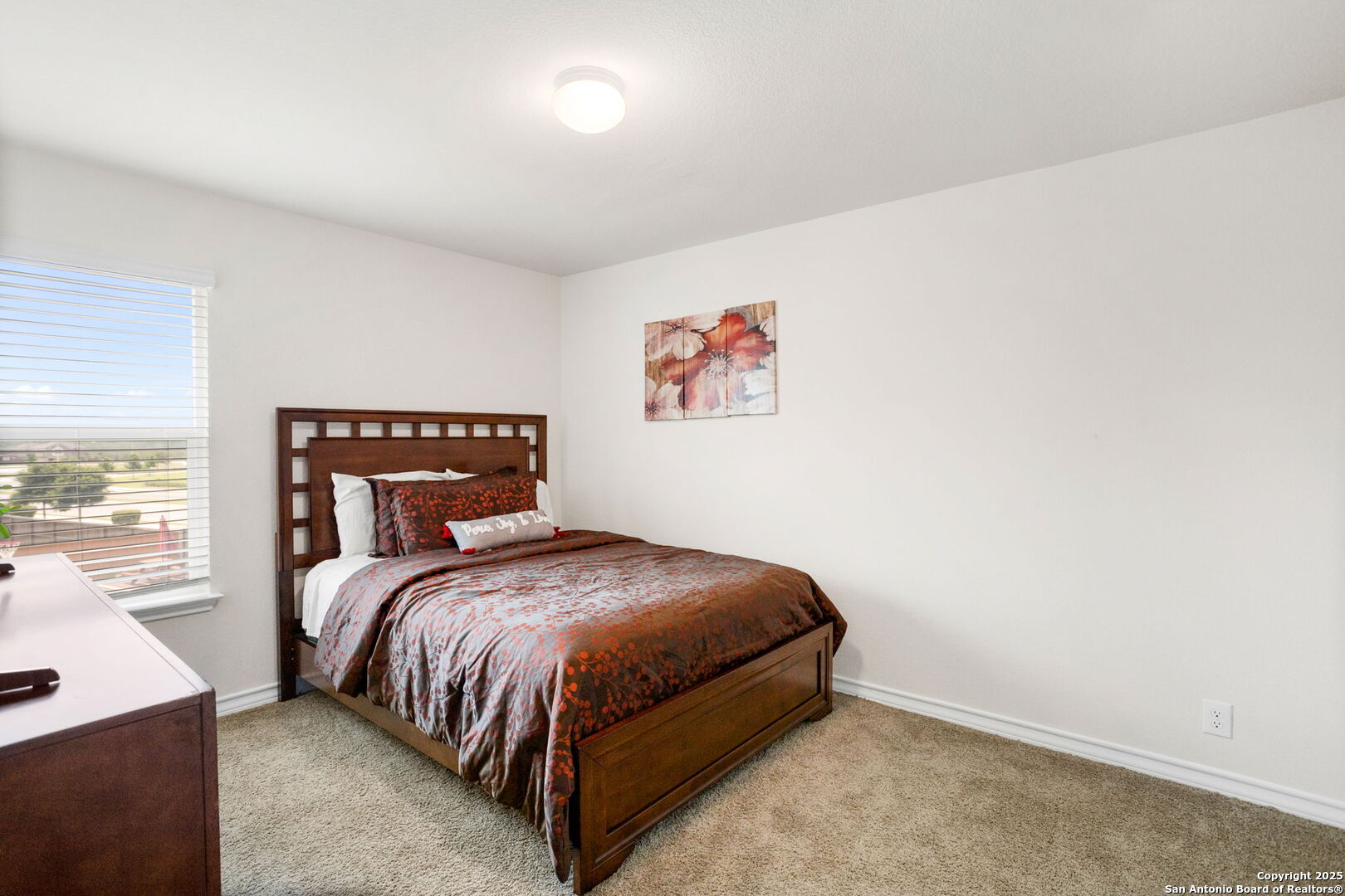 104 Mossy Bank Cibolo, TX 78108 - Photo 22 of 30 a bedroom with a bed and a painting on the wall