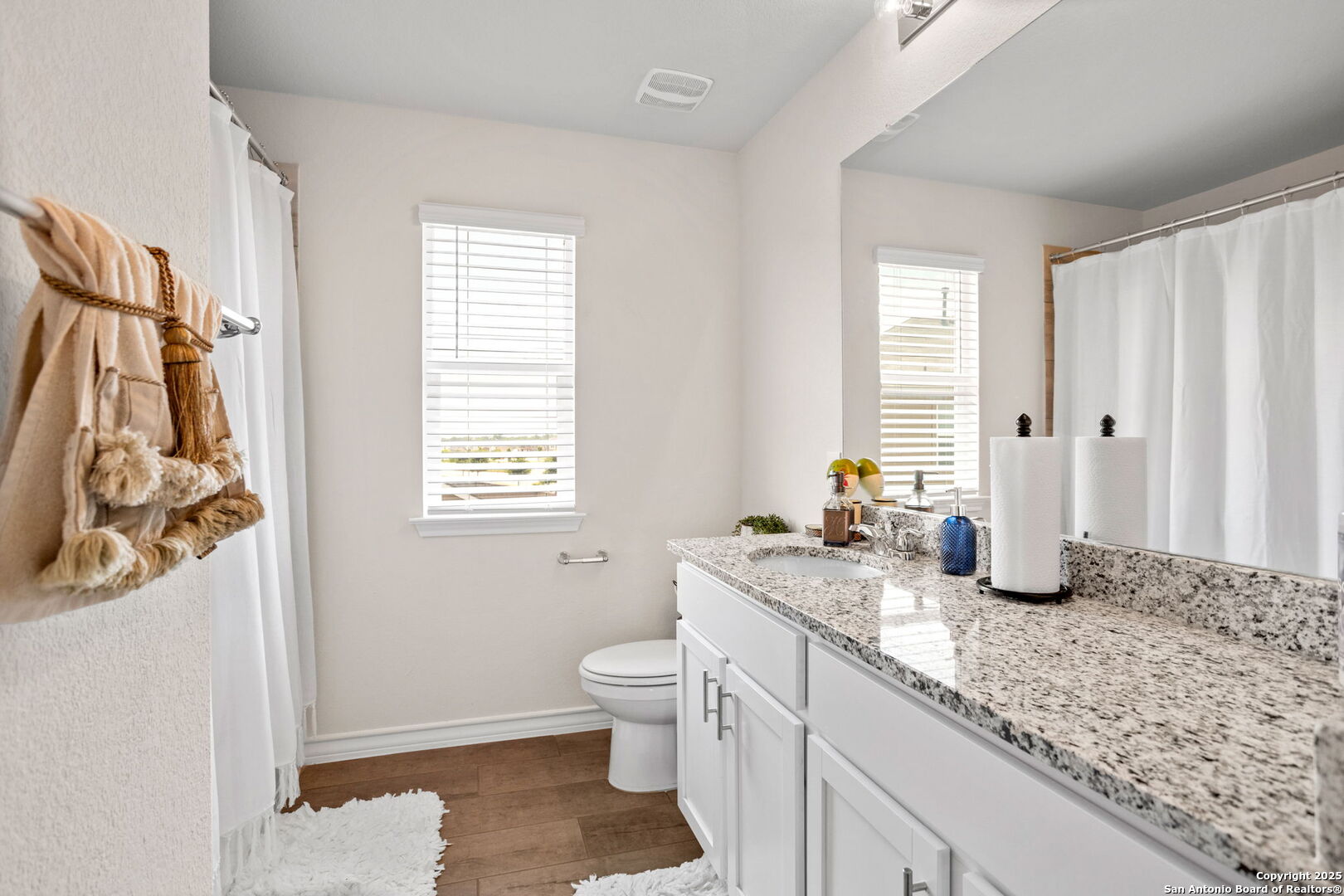 104 Mossy Bank Cibolo, TX 78108 - Photo 23 of 30 a bathroom with a granite countertop sink and a mirror