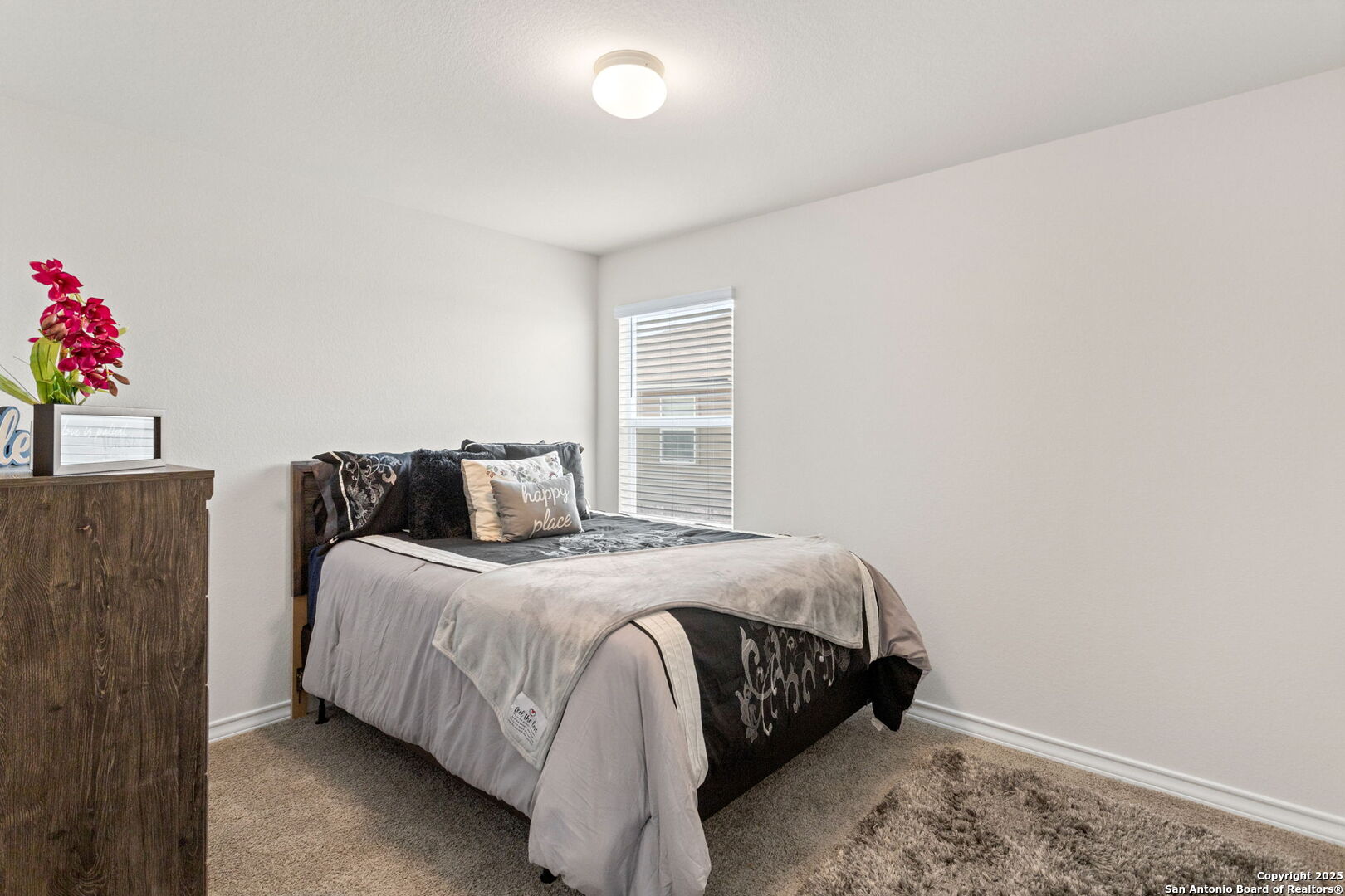 104 Mossy Bank Cibolo, TX 78108 - Photo 24 of 30 a bedroom with a bed and a window