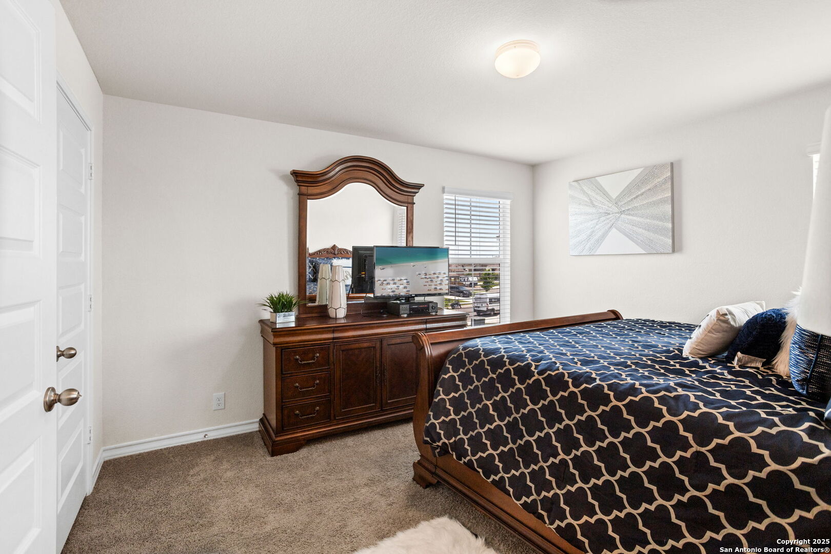 104 Mossy Bank Cibolo, TX 78108 - Photo 25 of 30 a bedroom with a bed and window