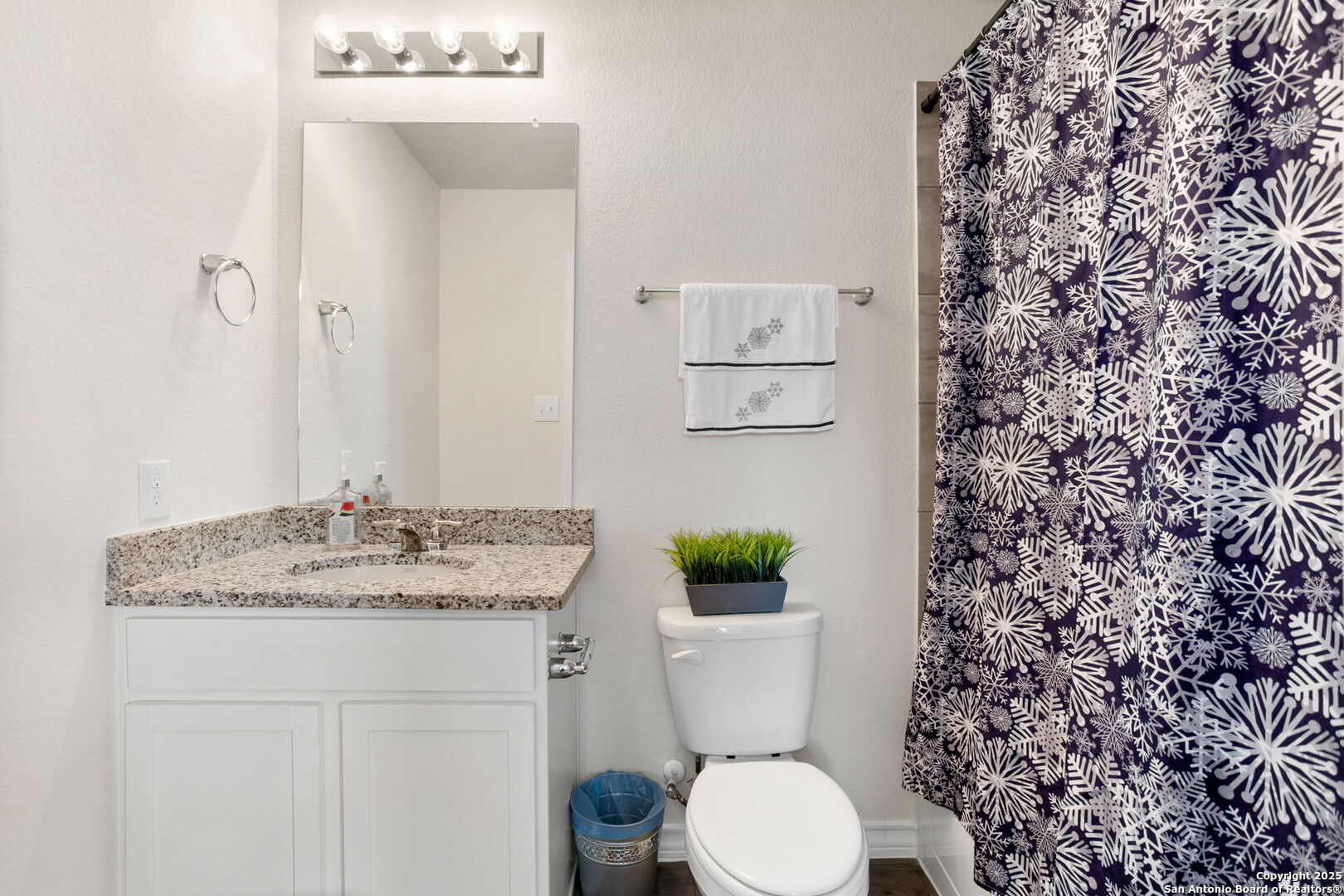 104 Mossy Bank Cibolo, TX 78108 - Photo 26 of 30 a bathroom with a granite countertop toilet and a sink