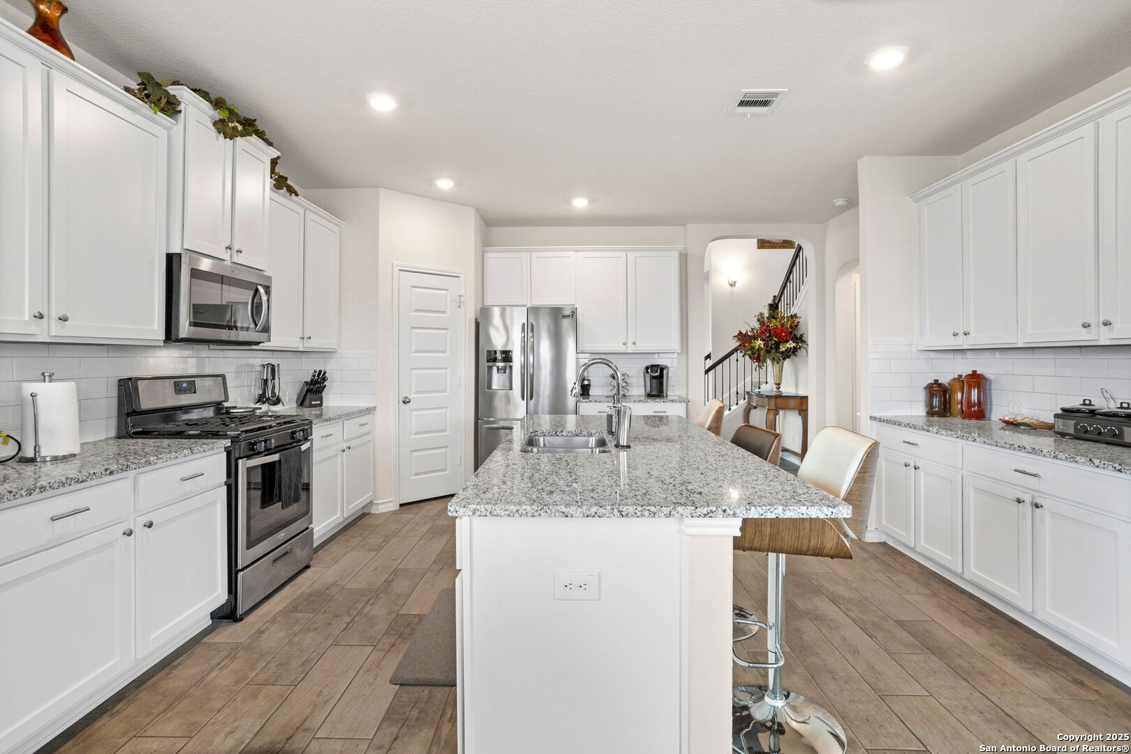 104 Mossy Bank Cibolo, TX 78108 - Photo 3 of 30 a kitchen with stainless steel appliances granite countertop a sink dishwasher stove top oven and refrigerator
