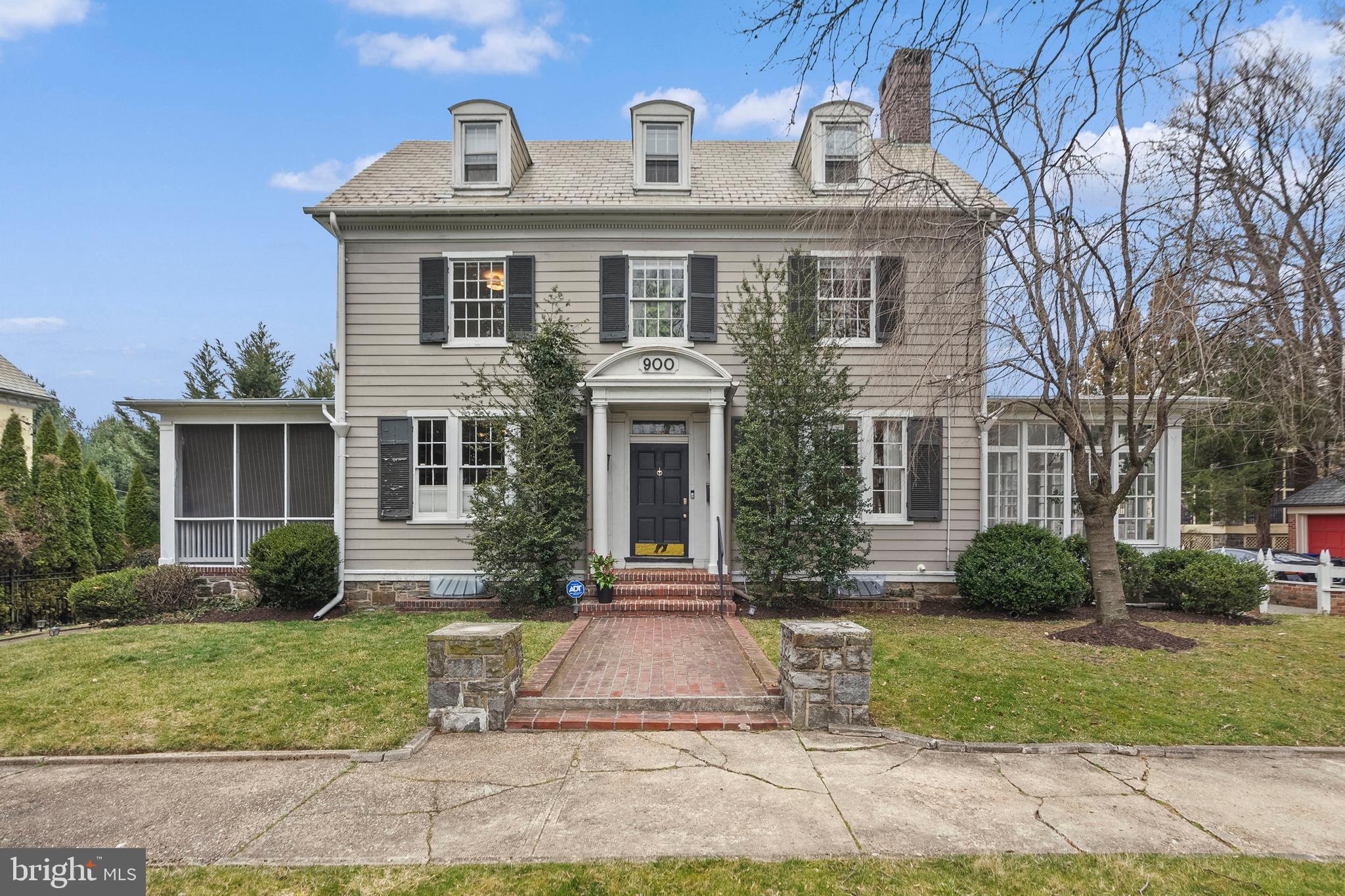 900 West Northern Parkway Baltimore, MD 21210 - Photo 1 of 63 a front view of a house with garden