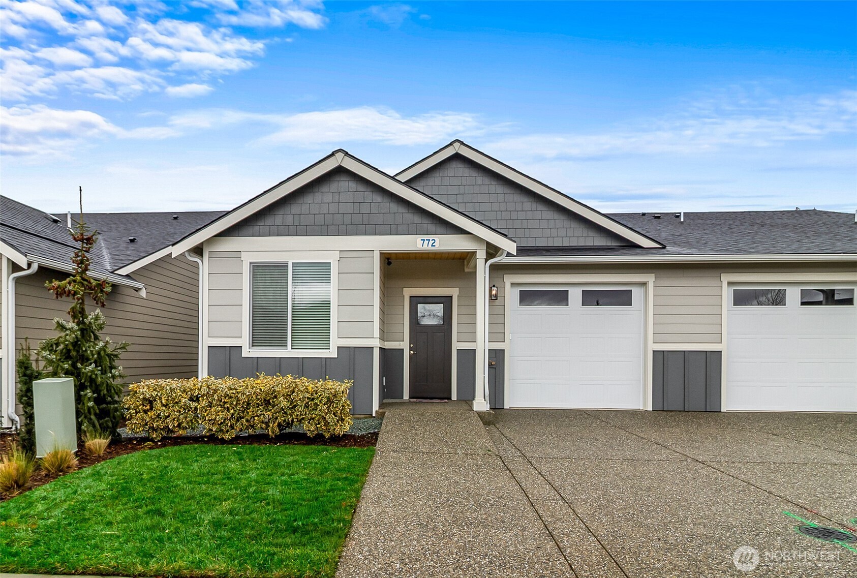 772 Parkland Loop Sedro-Woolley, WA 98284 - Photo 2 of 40 a front view of a house with a garage