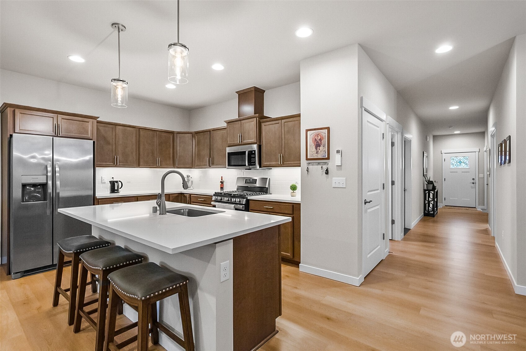 772 Parkland Loop Sedro-Woolley, WA 98284 - Photo 22 of 40 a kitchen with stainless steel appliances kitchen island granite countertop a refrigerator a sink and a stove