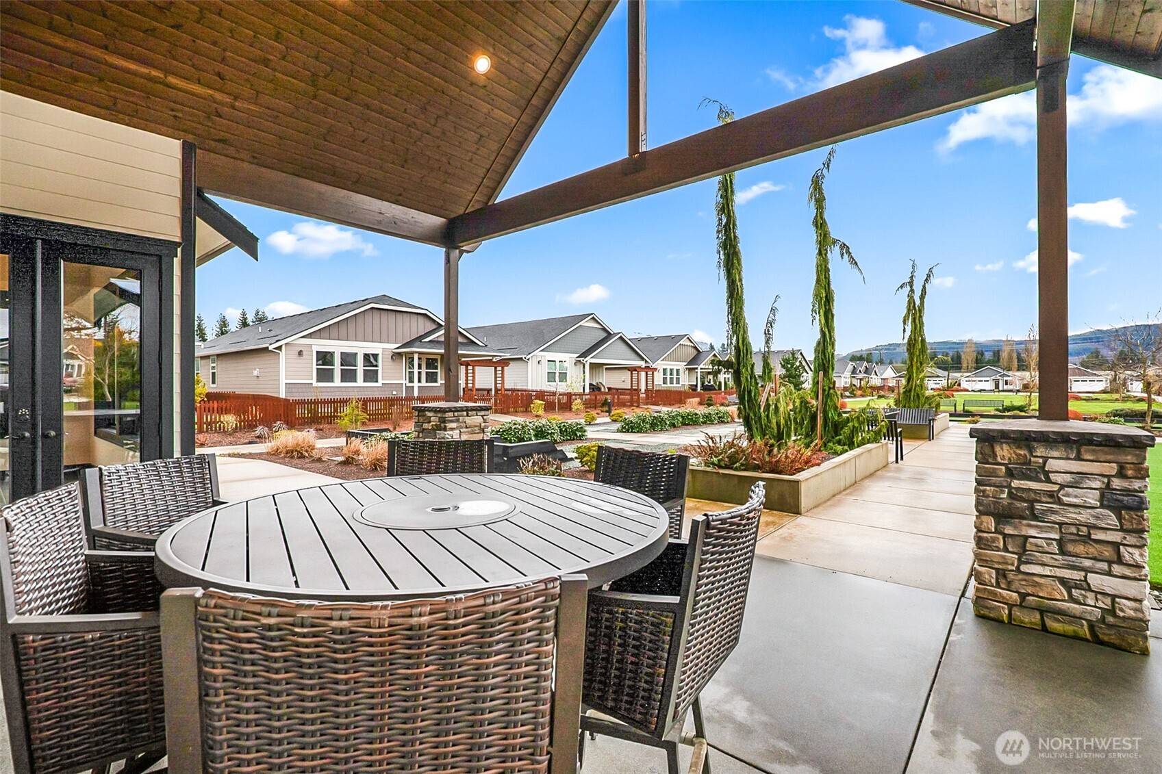 772 Parkland Loop Sedro-Woolley, WA 98284 - Photo 37 of 40 a view of a balcony with table and chairs