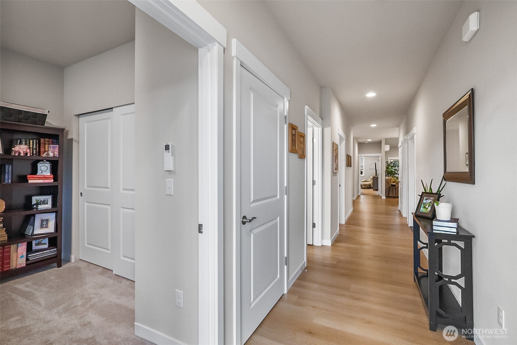 772 Parkland Loop Sedro-Woolley, WA 98284 - Photo 4 of 40 a view of a hallway with wooden floor and furniture