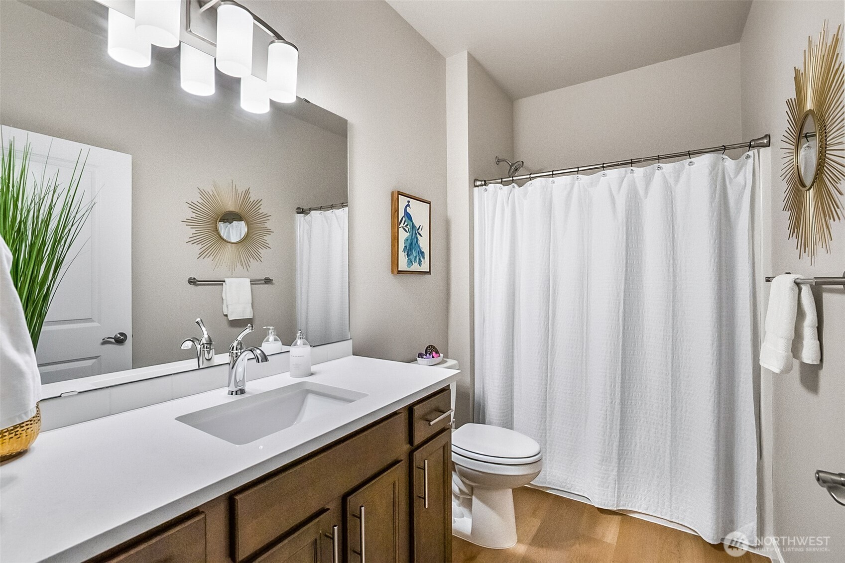 772 Parkland Loop Sedro-Woolley, WA 98284 - Photo 7 of 40 a bathroom with a sink a toilet and shower curtain