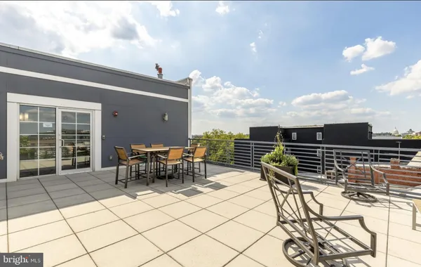 a view of a terrace with furniture