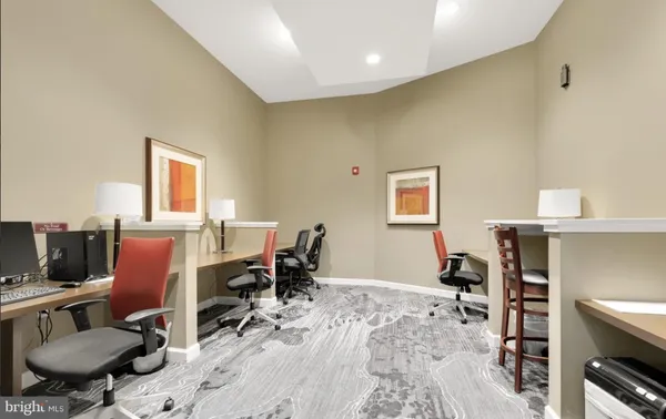 a workspace with furniture and wooden floor
