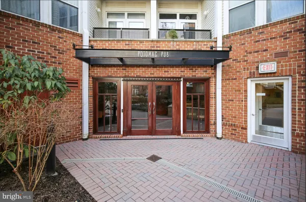 a view of a brick building with large windows