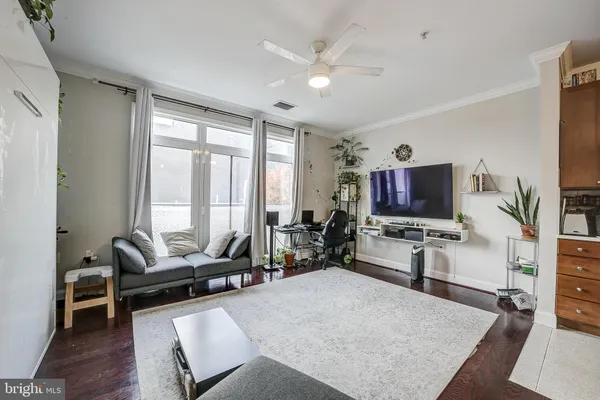a living room with furniture and a flat screen tv
