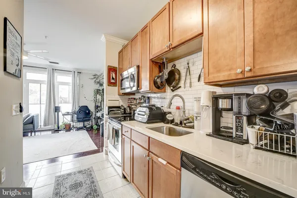 a kitchen with lots of counter top space and a window