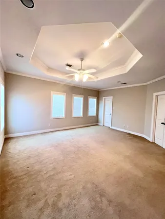 a view of an empty room with windows