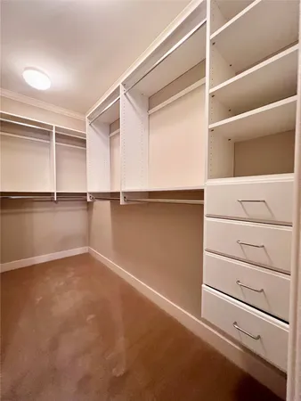 a view of an empty walk in closet
